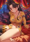  1girl bangs black_hair black_legwear bleemjay breasts cleavage collarbone earrings fate/grand_order fate_(series) highres ishtar_(fate) jewelry large_breasts long_hair long_sleeves looking_at_viewer navel on_bed parted_bangs red_eyes shirt single_thighhigh sitting solo thighhighs thighlet thighs toes two_side_up yellow_shirt 