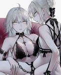  2girls ahoge armband artoria_pendragon_(fate) breasts chain choker commentary eyebrows_visible_through_hair fate/grand_order fate_(series) grey_hair hair_between_eyes hair_bun highres jeanne_d&#039;arc_(alter)_(fate) jeanne_d&#039;arc_(fate) long_hair looking_at_viewer looking_back medium_breasts multiple_girls nipi27 parted_lips saber_alter simple_background sitting sitting_on_lap sitting_on_person small_breasts teeth white_background yellow_eyes yuri 