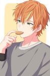  1boy bangs blonde_hair cookie earrings eating food green_eyes grey_shirt hand_up highres jewelry male_focus multicolored_hair orange_hair project_sekai sekina shinonome_akito shirt short_hair simple_background solo two-tone_hair upper_body 