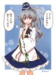 1girl blue_eyes blue_headwear blue_skirt blush border commentary_request commission eyebrows_visible_through_hair feet_out_of_frame grey_hair hair_between_eyes hat highres japanese_clothes kariginu long_hair looking_at_viewer mononobe_no_futo open_mouth pom_pom_(clothes) ponytail shitacemayo skirt sleeves_past_wrists smug solo speech_bubble tate_eboshi touhou translation_request twitter_username white_border wide_sleeves 