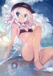  1girl absurdres bikini black_bikini black_hat blue_eyes closed_mouth commentary_request flat_cap hat hibiki_(kancolle) highres kaamin_(mariarose753) kantai_collection knees_up long_hair peaked_cap sitting solo swimsuit white_hair 