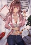  1girl absurdres ahoge bed black_pants bottle breasts brown_hair cleavage commentary_request cowboy_shot denim double_bun failure_penguin hairband_removed headgear highres jeans jewelry kantai_collection kongou_(kancolle) large_breasts long_hair looking_at_viewer lying official_alternate_costume pants pillow pink_coat purple_eyes ring shirt solo stuffed_animal stuffed_penguin stuffed_toy taki_rentaro wedding_band white_shirt 