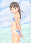 1girl arms_behind_back ass bangs beach bikini blue_bikini blunt_bangs brown_eyes brown_hair cloud commentary_request day flat_chest from_side highres long_hair looking_at_viewer ocean original outdoors own_hands_together sky smile solo swimsuit thighs uzuki_mei 