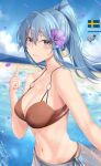  1girl bangs bare_arms bare_shoulders beach bikini blue_hair blue_sky breasts brown_bikini brown_eyes character_name cleavage collarbone cowboy_shot day eyebrows_visible_through_hair flower gotland_(kancolle) hair_flower hair_ornament highres index_finger_raised jenson_tw jewelry kantai_collection large_breasts lips long_hair mole mole_under_eye navel necklace o-ring o-ring_bikini o-ring_top ocean outdoors parted_lips petals ponytail purple_flower sarong sheep sidelocks sky smile solo stomach swedish_flag swimsuit water 