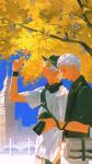  2boys arm_up bag baseball_cap black_hat black_pants black_shirt blue_sky brothers building camera collared_shirt commentary contemporary dante_(devil_may_cry) devil_may_cry_(series) ginkgo_leaf grey_pants hair_slicked_back hat headphones headphones_around_neck highres holding holding_camera holding_leaf leaf looking_up male_focus multiple_boys outdoors pants parted_bangs shirt short_sideburns short_sleeves shoulder_bag siblings sideburns sky standing tree twins vergil_(devil_may_cry) white_hair white_shirt wristband ykim01989882 