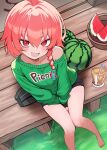 1girl absurdres arms_between_legs barefoot black_halo black_shorts blue_archive bra_strap braid commentary cup drinking_straw fang food foot_out_of_frame from_above fruit green_sweater halo highres juice light_blush looking_at_viewer looking_up mole mole_under_each_eye mole_under_eye multiple_moles neru_(blue_archive) official_alternate_costume on_floor open_mouth outdoors red_eyes red_hair shorts single_braid single_off_shoulder skin_fang smile solo stale_beer_(kinonuketa_biiru) sweater veranda watermelon watermelon_slice 