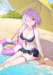  1girl alternate_costume artist_name beach bikini bikini_skirt black_bikini black_skirt black_swimsuit breasts cleavage collarbone commentary_request fate/grand_order fate_(series) hair_over_one_eye highres holding holding_umbrella innertube light_purple_hair looking_at_viewer mash_kyrielight medium_breasts navel one_eye_covered open_mouth palm_tree parasol partially_submerged purple_eyes sand short_hair sitting skirt smile solo swimsuit tongue tree umbrella water yeh_(354162698) yellow_umbrella 