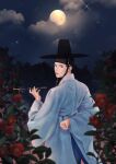  1boy absurdres arm_behind_back back black_hair black_headwear blue_robe blurry camellia cken_chi depth_of_field flower from_behind full_moon gat_(korean_traditional_hat) hair_pulled_back hanbok headband highres holding holding_pipe kiseru korean_clothes korean_commentary lips looking_at_viewer looking_back male_focus moon night nose original outdoors parted_lips pipe realistic robe short_hair sky smoke smoking solo sparkle standing star_(sky) starry_sky thick_lips topknot wide_sleeves 