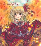  1girl :d aki_shizuha autumn_leaves bangs black_bow black_bowtie black_ribbon blonde_hair bow bowtie breasts cowboy_shot eyebrows_visible_through_hair fang frilled_skirt frills hair_ornament juliet_sleeves leaf_hair_ornament long_sleeves looking_at_viewer marker_(medium) medium_hair open_mouth orange_background orange_theme outdoors puffy_sleeves red_eyes red_shirt red_skirt ribbon rui_(sugar3) sample shirt skin_fang skirt skirt_hold sleeve_ribbon small_breasts smile solo touhou traditional_media tree 