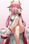  1girl anklet breasts commentary_request crossed_legs feet finger_to_mouth genshin_impact hair_ornament hand_on_hip highres japanese_clothes jewelry kacyu large_breasts looking_at_viewer naughty_face pink_hair purple_eyes sandals solo thick_thighs thighs toes tongue tongue_out yae_(genshin_impact) 