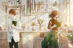  1boy 1girl book bookshelf brown_hair camera closed_eyes cup fusui holding holding_book indoors jar leaf light_rays looking_away medium_hair muted_color notebook original pen picture_(object) picture_frame plant potted_plant scenery short_hair signature skirt smile sunlight sweater window 