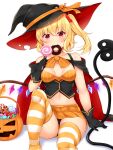  1girl alternate_costume arm_up bangs bare_shoulders black_cape black_gloves black_headwear blonde_hair blush bow breasts breasts_apart buttons candy cape collarbone commentary_request daichi_(tokoya) doughnut flandre_scarlet food food_in_mouth gloves halloween_bucket halloween_costume hat hat_bow hat_ribbon highres holding holding_candy holding_food holding_lollipop knees laevatein_(touhou) lollipop looking_at_viewer miniskirt navel one_side_up orange_bow orange_ribbon red_eyes ribbon side_ponytail simple_background sitting skirt small_breasts solo stomach striped striped_legwear thighhighs thighs touhou two-sided_cape two-sided_fabric white_background wings witch_hat 