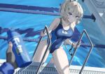  1girl 1other blonde_hair blue_eyes blue_swimsuit blurry bottle breasts commentary_request competition_swimsuit depth_of_field goggles goggles_removed groin highleg highleg_swimsuit lane_line looking_at_viewer medium_breasts morros one-piece_swimsuit original ponytail pool pool_ladder poolside swimsuit water water_bottle 