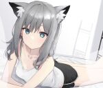  1girl absurdres animal_ear_fluff animal_ears arm_support bangs bare_shoulders bed black_shorts blue_archive blue_eyes bra_strap breasts camisole closed_mouth commentary dolphin_shorts dot_nose eyebrows_visible_through_hair feet_out_of_frame green_eyes grey_hair highres long_hair looking_at_viewer lying mismatched_pupils on_bed on_stomach shiroko_(blue_archive) shirt short_shorts shorts sidelocks small_breasts solo syhan white_shirt 