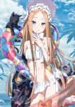  1girl :q abigail_williams_(fate) abigail_williams_(swimsuit_foreigner)_(fate) absurdres animal bangs bikini blonde_hair blue_sky blush bonnet cat cloud day fate/grand_order fate_(series) highres innertube long_hair looking_at_viewer palm_tree parted_bangs sky smile solo swimsuit tongue tongue_out tree white_bikini xkirara39x 