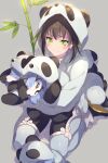  1girl animal bamboo bangs black_hair blush bodysuit breasts double_bun echo_(circa) eyebrows_behind_hair eyebrows_visible_through_hair fate/grand_order fate_(series) green_eyes grey_background holding hood hoodie pajamas panda qin_liangyu_(fate) simple_background sitting solo 