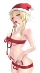  1girl absurdres blonde_hair blush breasts breath christmas cleavage english_commentary eyebrows_visible_through_hair feather_hair_ornament feathers from_side genshin_impact gweda hair_ornament hat highres looking_at_viewer lumine_(genshin_impact) medium_breasts medium_hair naked_ribbon navel parted_lips red_ribbon ribbon santa_hat sideboob sidelocks solo teeth_hold yellow_eyes 