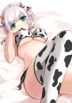  1girl absurdres animal_ears animal_print bangs bare_arms bare_shoulders bed_sheet bikini black_ribbon blurry blurry_foreground blush braid breasts cow_ears cow_girl cow_horns cow_print depth_of_field eyebrows_visible_through_hair foreshortening green_eyes hands_on_own_chest highres hololive horns knee_up kuro_(be_ok) large_breasts long_hair looking_at_viewer lying on_back on_bed open_mouth print_bikini print_legwear ribbon shirogane_noel side-tie_bikini silver_hair solo swimsuit twin_braids underboob virtual_youtuber white_bikini white_legwear 