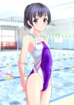  1girl absurdres arms_behind_back black_hair blurry blurry_background breasts brown_eyes clothes_writing competition_swimsuit cowboy_shot highres lane_line logo looking_at_viewer multicolored_clothes multicolored_swimsuit one-piece_swimsuit original ponytail pool short_hair short_ponytail small_breasts smile solo standing string_of_flags swimsuit takafumi 