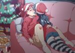  2girls between_legs blue_hair blush can christmas_ornaments christmas_tree closed_eyes couch ecoman eyebrows_visible_through_hair food gift hat highres indoors kiss knee_blush love_live! love_live!_sunshine!! multiple_girls on_couch pillow pizza red_hair sakurauchi_riko santa_hat socks star_ornament symbol-only_commentary tsushima_yoshiko yuri 