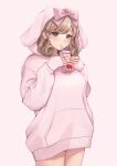  1girl absurdres animal_hood bangs blonde_hair bow breasts bunny_hood commentary_request cowboy_shot curly_hair drinking drinking_straw eyelashes food fruit green_eyes hair_bow half-closed_eyes haruka_(senran_kagura) highres holding hood hoodie juice_box lemonrou medium_hair pink_bow pink_hoodie senran_kagura solo strawberry thighs 