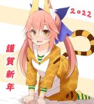  1girl 2022 :d akeome all_fours animal_costume animal_ear_fluff animal_ears animal_print bangs blue_ribbon brown_eyes chinese_zodiac collarbone commentary_request eyebrows_visible_through_hair fang fate/extra fate_(series) fox_ears fox_girl hair_between_eyes hair_ribbon happy_new_year haryuu_(poetto) highres hood hood_down long_hair looking_at_viewer new_year pink_hair ribbon smile solo tail tamamo_(fate) tamamo_no_mae_(fate/extra) tiger_costume tiger_print tiger_tail translation_request twintails year_of_the_tiger younger 