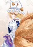  1girl animal_ears blonde_hair blush breasts closed_mouth dress fox_ears fox_tail hair_between_eyes hat highres large_breasts long_sleeves looking_at_viewer mob_cap multiple_tails sarasadou_dan short_hair slit_pupils solo tail touhou white_dress white_headwear wide_sleeves yakumo_ran yellow_eyes 