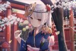  1girl animal_on_shoulder backlighting bangs blue_kimono blurry blurry_background blush commentary dango floral_print flower food grey_hair hair_flower hair_ornament head_tilt highres holding holding_food japanese_clothes kimono light_smile looking_at_viewer mask mask_on_head original outdoors red_flower short_ponytail shrine sidelocks smile solo stuffed_animal stuffed_tiger stuffed_toy tiger_mask_(object) torii touhourh tree upper_body wagashi white_flower yellow_eyes 