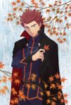  1boy autumn_leaves belt black_cape cape closed_mouth commentary_request day grey_eyes hand_up highres holding holding_leaf imasara_maki jacket lance_(pokemon) leaf long_sleeves looking_down male_focus outdoors pants pokemon pokemon_(game) pokemon_hgss popped_collar red_hair short_hair smile solo spiked_hair 
