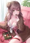  1girl blush box box_of_chocolates breasts candy cardigan chocolate cleavage come_hither couch daidai_jamu finger_to_mouth floral_print food food_in_mouth green_eyes hair_bun heart heart-shaped_chocolate highres lace-trimmed_camisole lace_trim large_breasts long_hair looking_at_viewer no_pants open_cardigan open_clothes original print_camisole sitting solo valentine wavy_hair 
