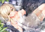 1girl bangs bathing blonde_hair blush breast_lift breasts cleavage closed_mouth collarbone commentary_request eyebrows_visible_through_hair highres holding holding_towel leaf looking_at_viewer medium_breasts naked_towel onsen original partially_submerged rock shimofuri_takenoko sidelocks sitting smile solo towel yellow_eyes 