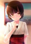  1girl absurdres black_hair blurry blurry_background blush closed_mouth dougi eyebrows_visible_through_hair hakama highres japanese_clothes kantai_collection looking_at_viewer picture_(object) red_hakama ruin_re_birth short_hair short_sleeves smile solo un&#039;you_(kancolle) upper_body yawata_maru_(kancolle) yellow_eyes 