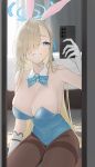  1girl absurdres animal_ears asuna_(blue_archive) asuna_(bunny)_(blue_archive) asymmetrical_bangs blonde_hair blue_archive blue_bow blue_bowtie blue_eyes blue_halo blue_leotard bow bowtie breasts cellphone fake_animal_ears gangjeong gloves hair_over_one_eye halo highres indoors leotard long_hair mirror mole mole_on_breast official_alternate_costume pantyhose phone playboy_bunny selfie strapless strapless_leotard thighband_pantyhose traditional_bowtie white_gloves 