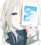  1girl blonde_hair blush cloud face green_eyes green_ribbon hair_ribbon half-closed_eyes holding holding_picture long_hair original parted_lips picture_(object) qidius ribbon signature simple_background sleeves_past_wrists smile solo upper_body white_background 