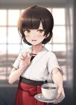  1girl black_hair blurry blurry_background blush brown_eyes coffee collarbone cup dougi eyebrows_visible_through_hair hakama highres holding ichikawa_feesu japanese_clothes kantai_collection looking_at_viewer open_mouth red_hakama short_hair short_sleeves smile solo teeth upper_body upper_teeth yawata_maru_(kancolle) 