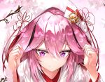  1girl absurdres animal_ears bangs branch cherry_blossoms close-up closed_mouth dress fox_ears gr_greeze hair_between_eyes highres honkai_(series) honkai_impact_3rd japanese_clothes kimono long_hair long_sleeves looking_at_viewer looking_back petals pink_hair purple_eyes smile solo wedding_dress white_kimono yae_sakura yae_sakura_(gyakushinn_miko) 