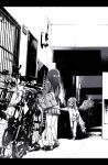  2girls bag bicycle commentary_request greyscale ground_vehicle horror_(theme) long_hair long_sleeves miniskirt monochrome multiple_girls mutation original shoes shoulder_bag skirt socks tokomichi wings 