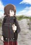  1girl absurdres backpack bag bangs blue_sky brown_eyes brown_hair casual cloud cloudy_sky commentary day dirt_road eyebrows_visible_through_hair girls_und_panzer grey_jacket highres hiking_pole holding jacket long_sleeves looking_to_the_side mountain mountainous_horizon nishizumi_maho open_mouth oritako outdoors road short_hair sky smile solo standing 