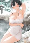  1girl arm_up armpits bare_arms bare_shoulders black_hair blue_eyes breasts bucket cleavage closed_mouth commentary_request covered_navel day fed_(giba) highres large_breasts looking_at_viewer naked_towel one_eye_closed onsen original outdoors rock short_hair_with_long_locks sidelocks sitting snowing solo steam stone_lantern towel water winter wooden_bucket 