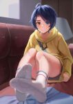  1girl absurdres bangs blue_eyes blue_hair blush brown_shorts closed_mouth couch full_body hair_ornament hairpin heterochromia highres hood hoodie indoors long_sleeves looking_at_viewer no_shoes ooto_ai shorts sitting soles solo taichi_suzuki toes white_legwear wonder_egg_priority yellow_eyes yellow_hoodie 