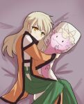  1girl arong bed bed_sheet blonde_hair body_pillow cuddling eyebrows_visible_through_hair green_skirt hat long_hair long_sleeves looking_at_viewer lying matara_okina no_hat no_headwear object_hug orange_sleeves pillow pillow_hat pillow_hug skirt smile solo tabard touhou wide_sleeves yakumo_yukari yellow_eyes 