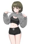  1girl :o black_shorts breast_cutout breasts cleavage cowboy_shot dolphin_shorts green_eyes green_hair grey_hoodie groin highres holding hood hoodie idolmaster idolmaster_shiny_colors looking_at_viewer looking_to_the_side midriff nanakusa_nichika navel short_hair shorts sideways_glance simple_background solo sports_bra syhan white_background 