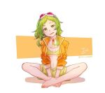  1girl bare_legs barefoot between_legs brooch carrot commentary full_body goggles goggles_on_head green_eyes green_hair green_shorts green_tube_top gumi hand_between_legs head_tilt indian_style jacket jewelry light_blush medium_hair megpoid_(vocaloid3) mi_no_take midriff navel open_mouth orange_jacket red_goggles shorts simple_background sitting smile solo strapless tube_top twitter_username vocaloid white_background 