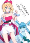  1girl absurdres bare_arms bare_shoulders blonde_hair bracelet breasts cleavage clenched_hands closed_mouth collarbone commentary english_text eyebrows_visible_through_hair glaceon green_eyes hair_between_eyes hair_ornament hand_up highres irida_(pokemon) jewelry legs_apart looking_at_viewer pokemon pokemon_(game) pokemon_legends:_arceus shadow short_hair shorts simple_background smile toes white_background white_shorts yoshiwo_senpai 