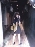  1girl alley ankle_socks back_cutout bangs black_eyes black_hair blunt_bangs bob_cut clothing_cutout dress from_behind hat holding holding_clothes holding_hat looking_back mosuko original photo_background shoes short_hair short_sleeves sneakers socks solo sun_hat 