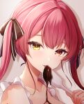  1girl bangs brown_ribbon chocolate commentary_request eating food_on_body hair_ribbon heterochromia highres holding holding_spatula hololive houshou_marine long_hair looking_at_viewer miyagi_ratona portrait red_eyes red_hair ribbon simple_background solo spatula tongue tongue_out twintails twitter_username virtual_youtuber yellow_eyes 