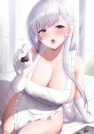  1girl :o apron azur_lane bangs belfast_(azur_lane) blush breasts candy chocolate cleavage collarbone elbow_gloves eyebrows_visible_through_hair food futon_fly_away gloves heart heart-shaped_chocolate highres large_breasts long_hair looking_at_viewer open_mouth purple_eyes sideboob silver_hair sitting solo thighs valentine white_apron white_gloves 