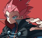  1boy black_cloak blue_eyes blue_jacket cloak closed_mouth commentary_request fingernails frown hand_up highres hyou_(hyouga617) jacket lance_(pokemon) male_focus pink_hair pink_pupils pokemon pokemon_(game) pokemon_hgss popped_collar red_background short_hair simple_background solo spiked_hair upper_body 