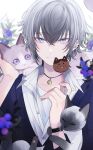  1boy animal animal_on_head blue_eyes candy cat close-up ear_piercing food hair_between_eyes highres holding holding_food looking_at_viewer muon on_head original piercing siamese_cat solo symbol-only_commentary watch white_hair wristwatch 