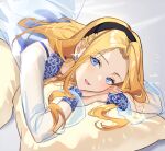  1girl bed_sheet black_headband blonde_hair blue_eyes chibi_vanille commentary_request dress earrings floral_print forehead gown headband jewelry league_of_legends long_hair looking_at_viewer lux_(league_of_legends) lying on_stomach own_hands_together pillow rainbow_gradient see-through_sleeves solo sparkle 